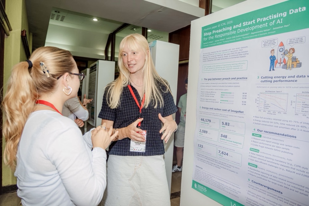 Discussing my poster at EEML 2026